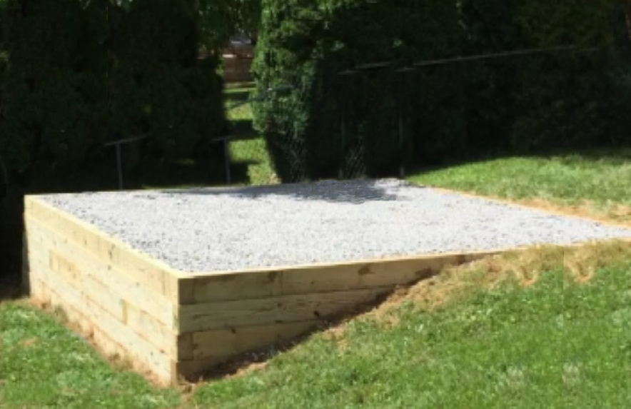 Concrete base with a timber sleeper surround